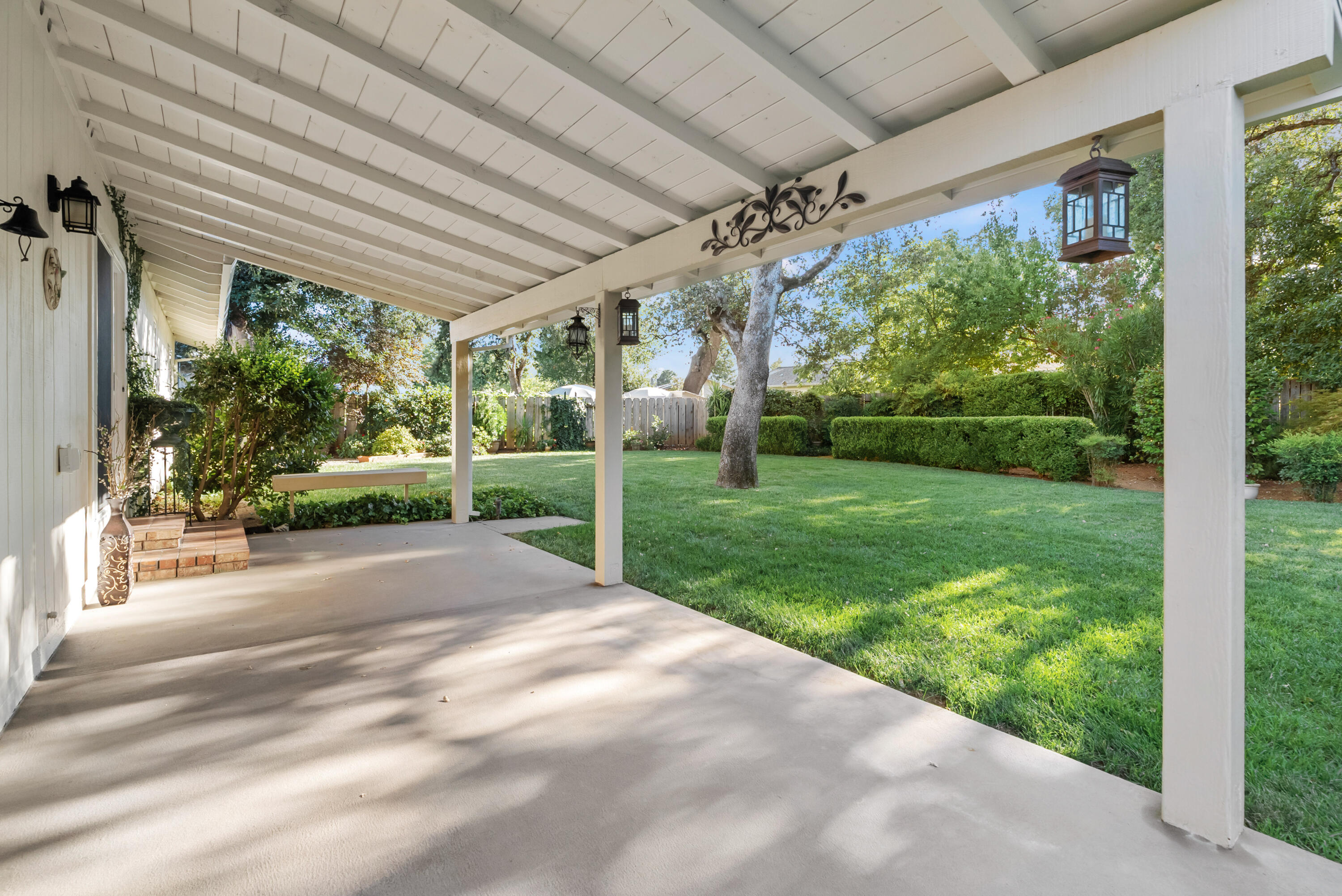 6812 Riata Drive Redding, CA 96002 - Photo 35 of 42 a view of a porch with garden