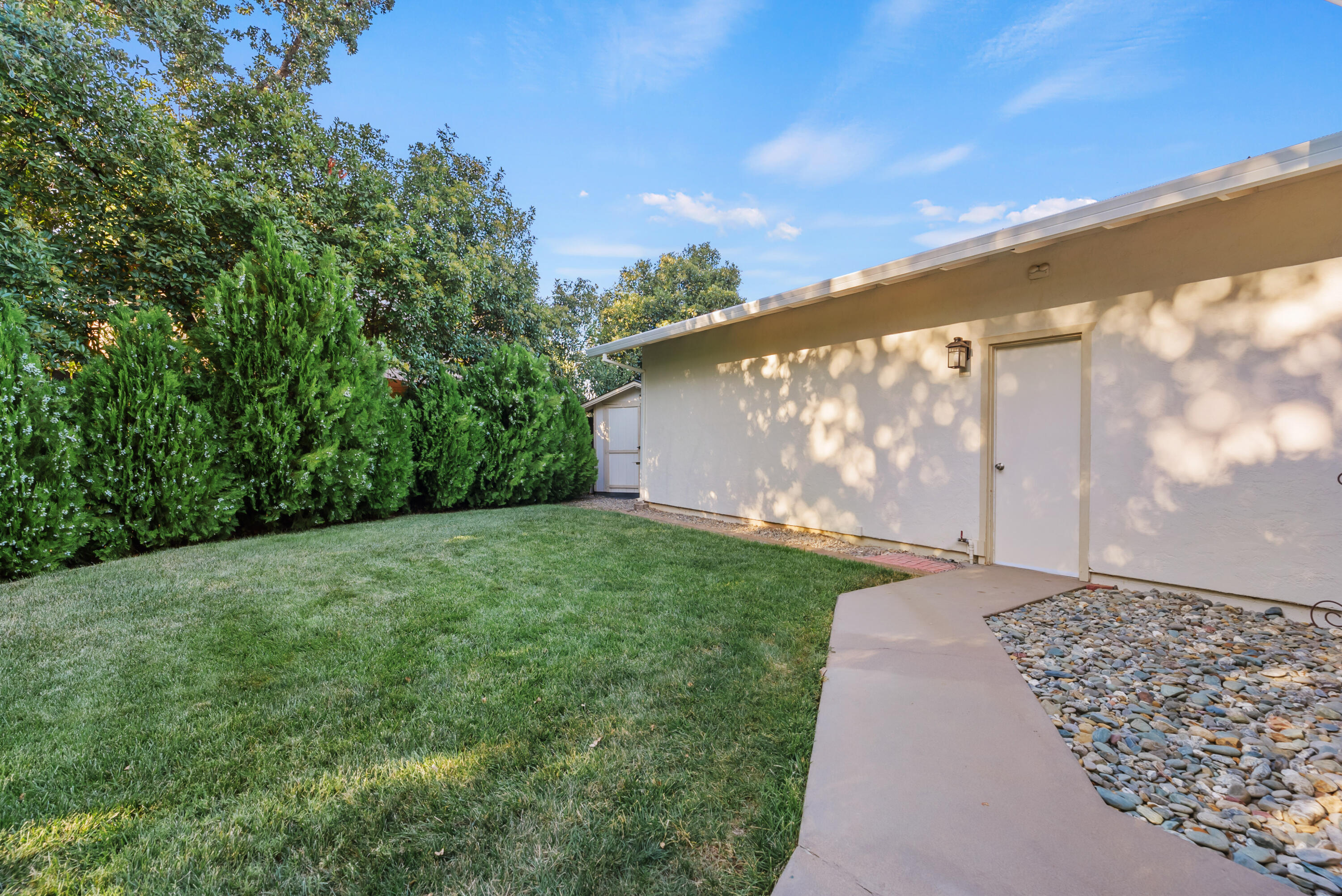 6812 Riata Drive Redding, CA 96002 - Photo 38 of 42 a view of a back yard with an outdoor space