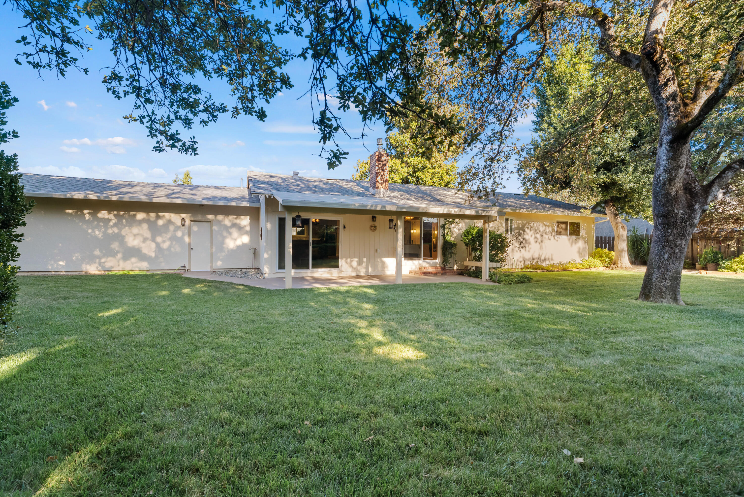 6812 Riata Drive Redding, CA 96002 - Photo 39 of 42 a view of a house with a backyard