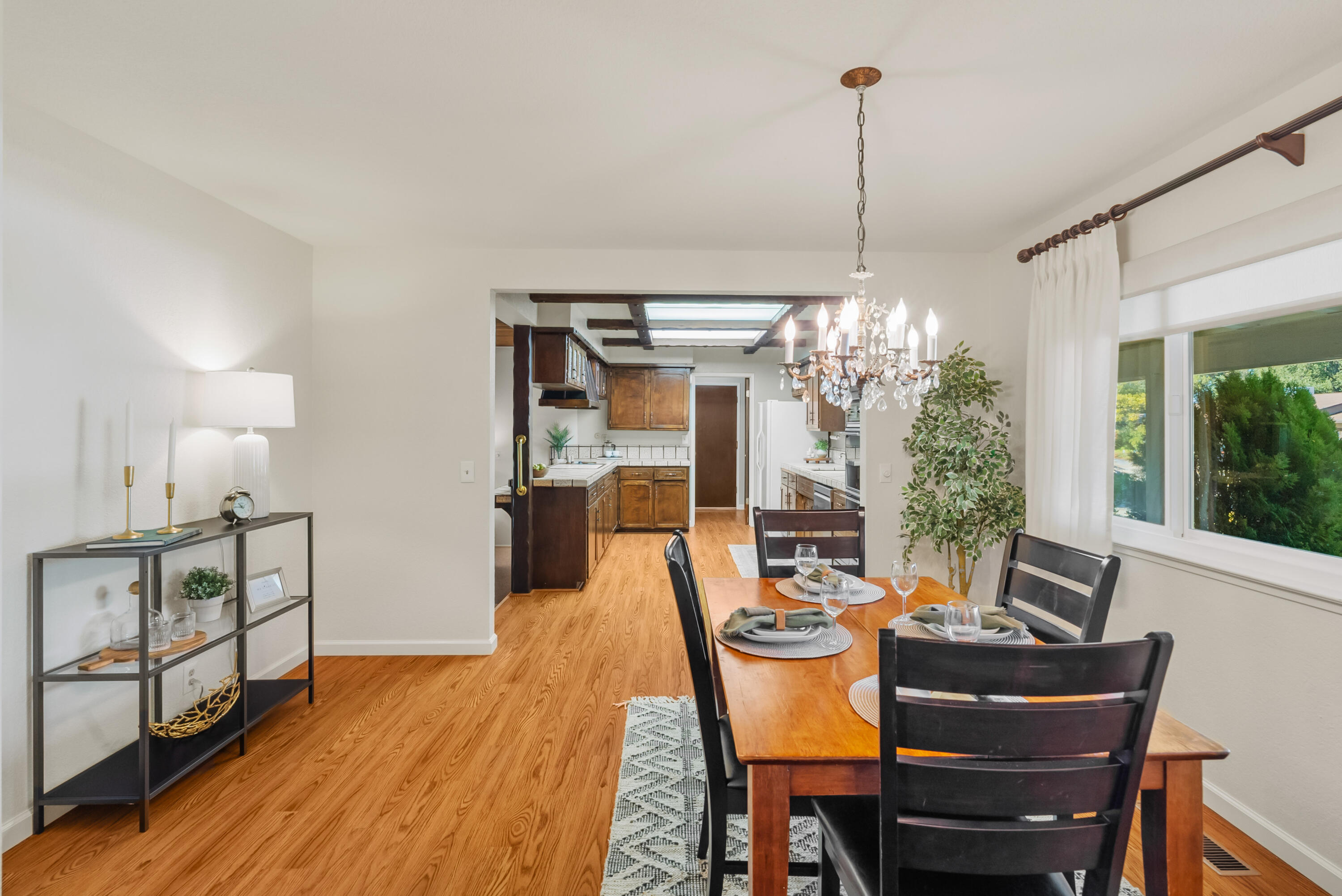 6812 Riata Drive Redding, CA 96002 - Photo 9 of 42 a view of a dining room with furniture window and wooden floor
