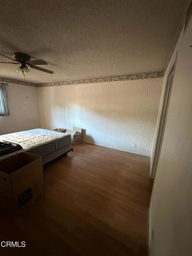 4591 Hempstead Street Simi Valley, CA 93063 - Photo 12 of 47 a bedroom with a bed and a table