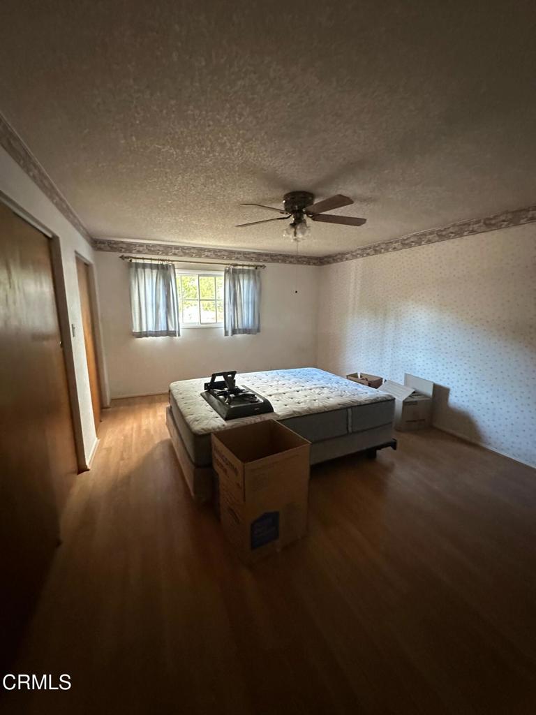 4591 Hempstead Street Simi Valley, CA 93063 - Photo 13 of 47 a bedroom with a bed and window