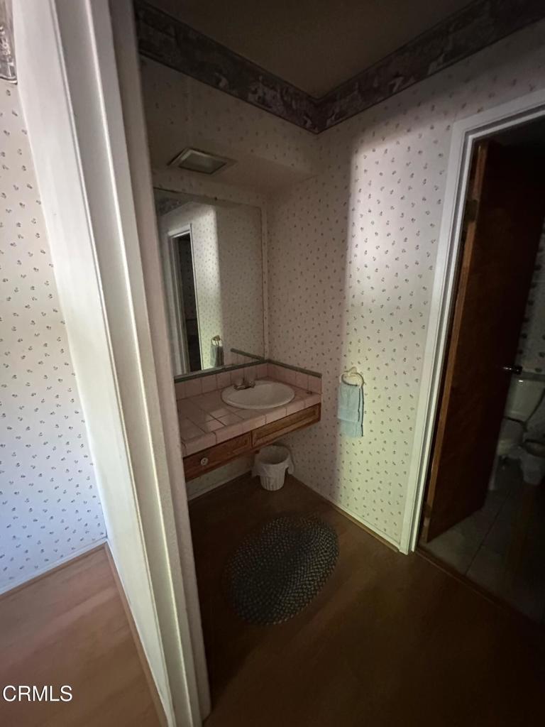 4591 Hempstead Street Simi Valley, CA 93063 - Photo 16 of 47 a bathroom with a sink and a mirror