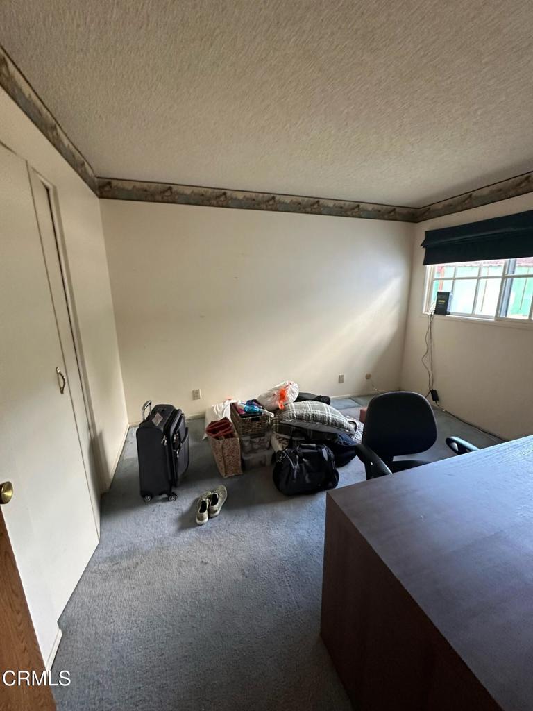 4591 Hempstead Street Simi Valley, CA 93063 - Photo 17 of 47 a bedroom with bed and window