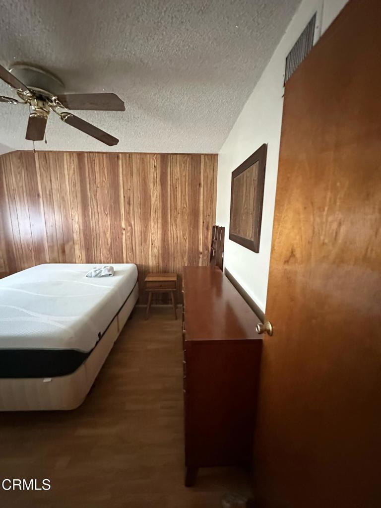 4591 Hempstead Street Simi Valley, CA 93063 - Photo 26 of 47 a bedroom with a bed and a mirror