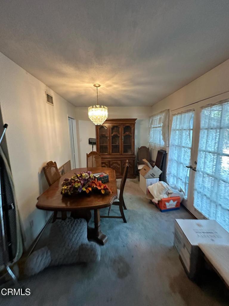 4591 Hempstead Street Simi Valley, CA 93063 - Photo 7 of 47 a living room with furniture and a flat screen tv