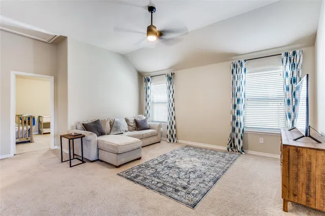 a living room with furniture and a rug