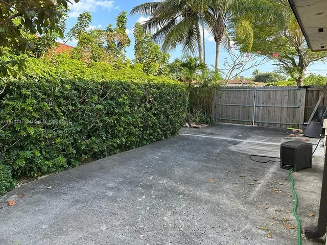 a view of a backyard with a trees