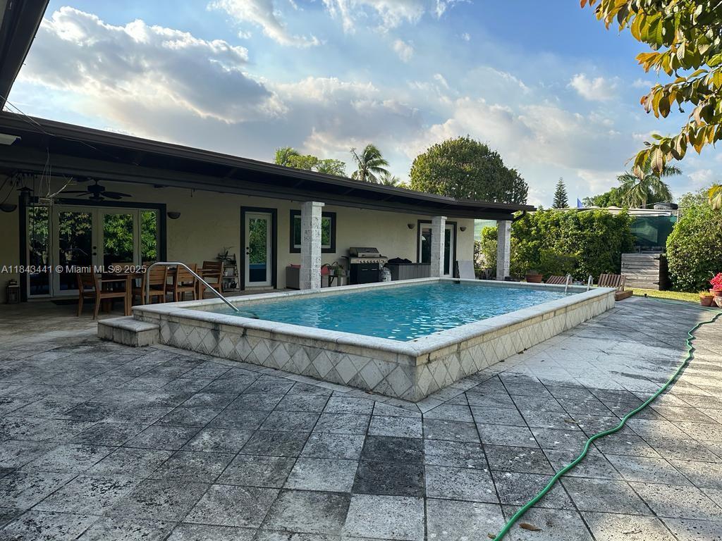 10375 Southwest 111th Street Miami, FL 33176 - Photo 7 of 30 a view of a house with backyard porch and sitting area