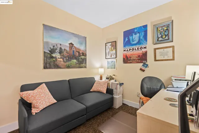 a living room with furniture and a chair