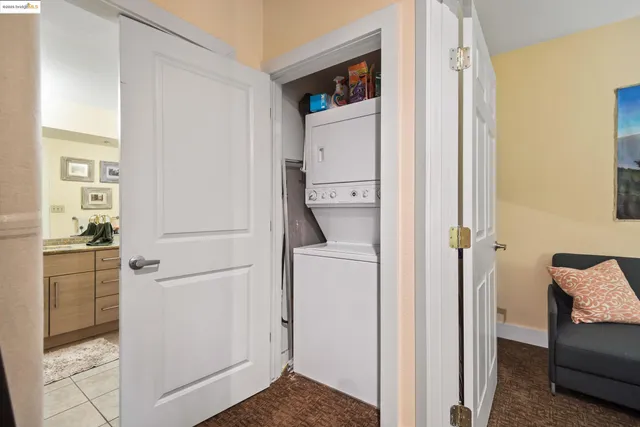 a view of kitchen with furniture and refrigerator