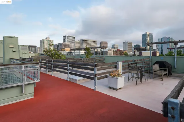 a living room with furniture a rug and white walls