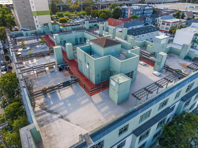 a view of city from balcony with outdoor seating