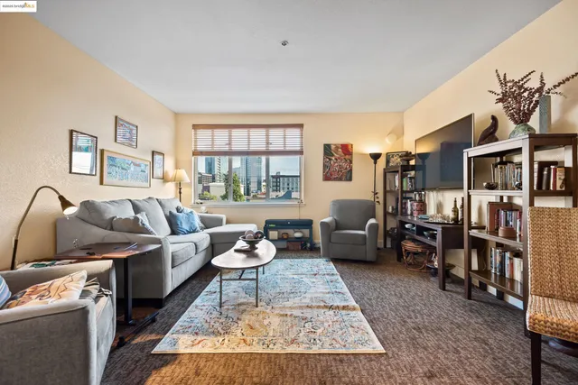 a living room with furniture and a rug