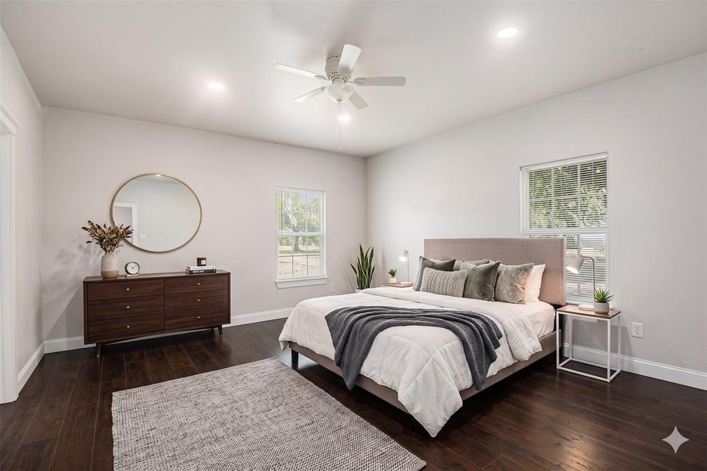 290 Aurora Street Rhome, TX 76078 - Photo 9 of 11 a bed room with a bed and a mirror