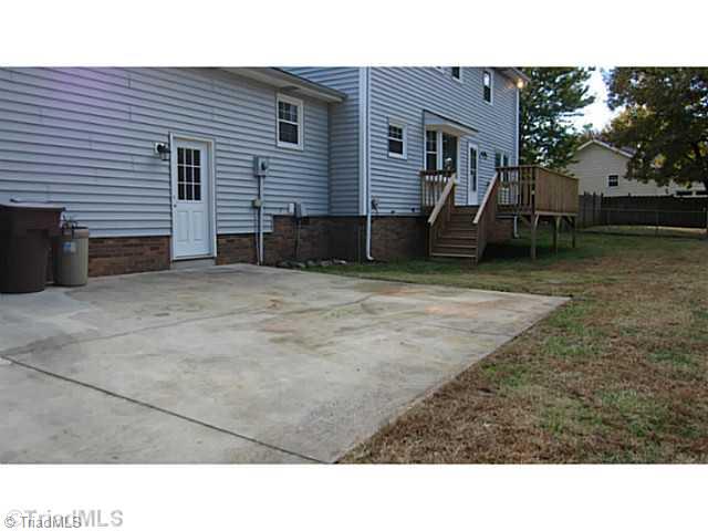5804 Old Oak Ridge Road Greensboro, NC 27410 - Photo 15 of 16 Exterior Back. Rear yard with nice size deck. This home sits on .92 acres of land.