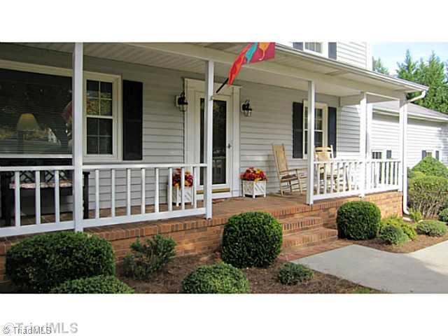 5804 Old Oak Ridge Road Greensboro, NC 27410 - Photo 3 of 16 Exterior Front. Covered Front Porch