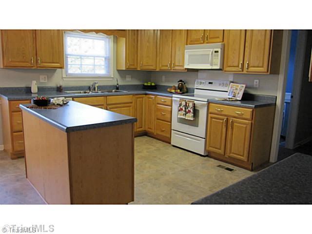 5804 Old Oak Ridge Road Greensboro, NC 27410 - Photo 10 of 16 Kitchen. Plenty of room for two cooks