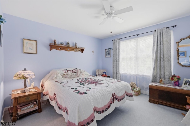 42 Copper Penny Road Flemington, NJ 08822 - Photo 27 of 39 a bedroom with a bed and a chandelier