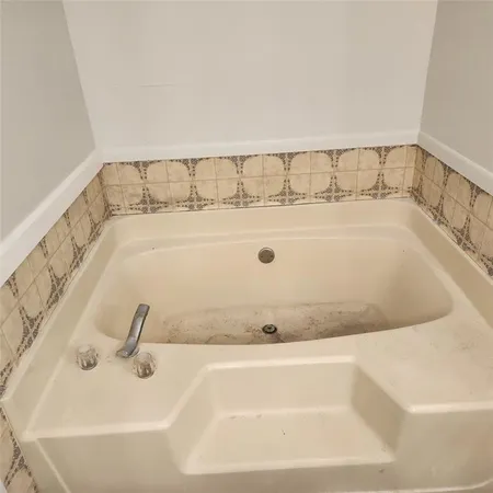 a bathroom with a bathtub