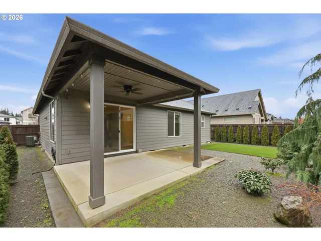 a backyard of a house with barbeque oven