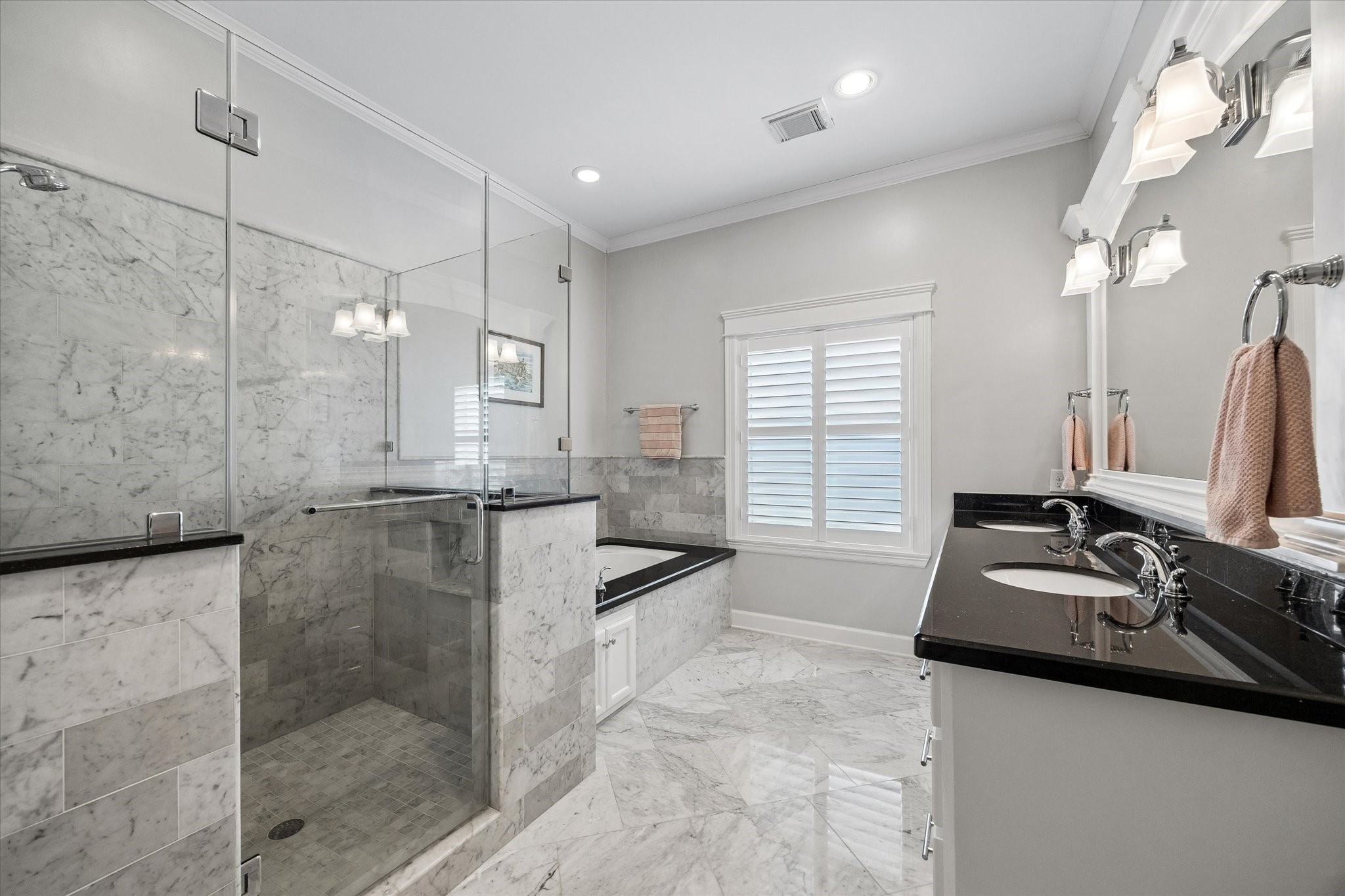 609 Rutland Street, Unit A Houston, TX 77007 - Photo 17 of 30 a bathroom with double vanity and a bathtub