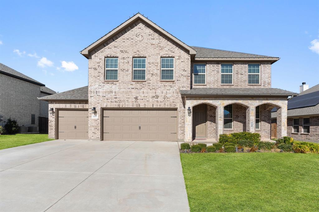 2012 Elara Drive Haslet, TX 76052 - Photo 1 of 34 a front view of a house with a yard and garage