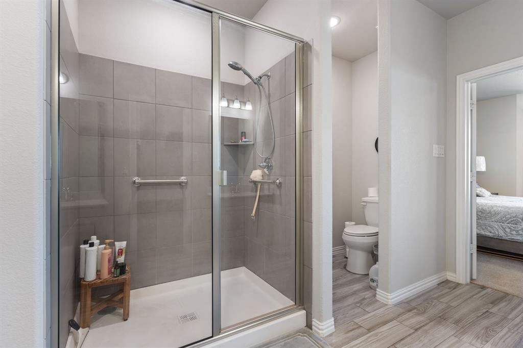2012 Elara Drive Haslet, TX 76052 - Photo 16 of 34 a bathroom with a shower and toilet