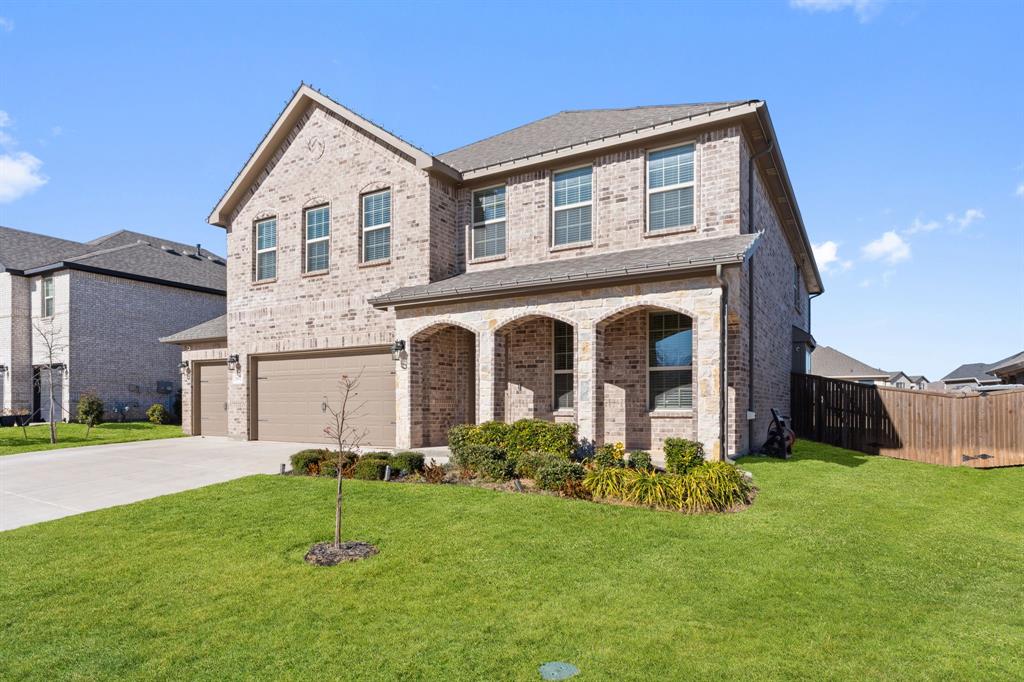 2012 Elara Drive Haslet, TX 76052 - Photo 2 of 34 a front view of house with yard and green space