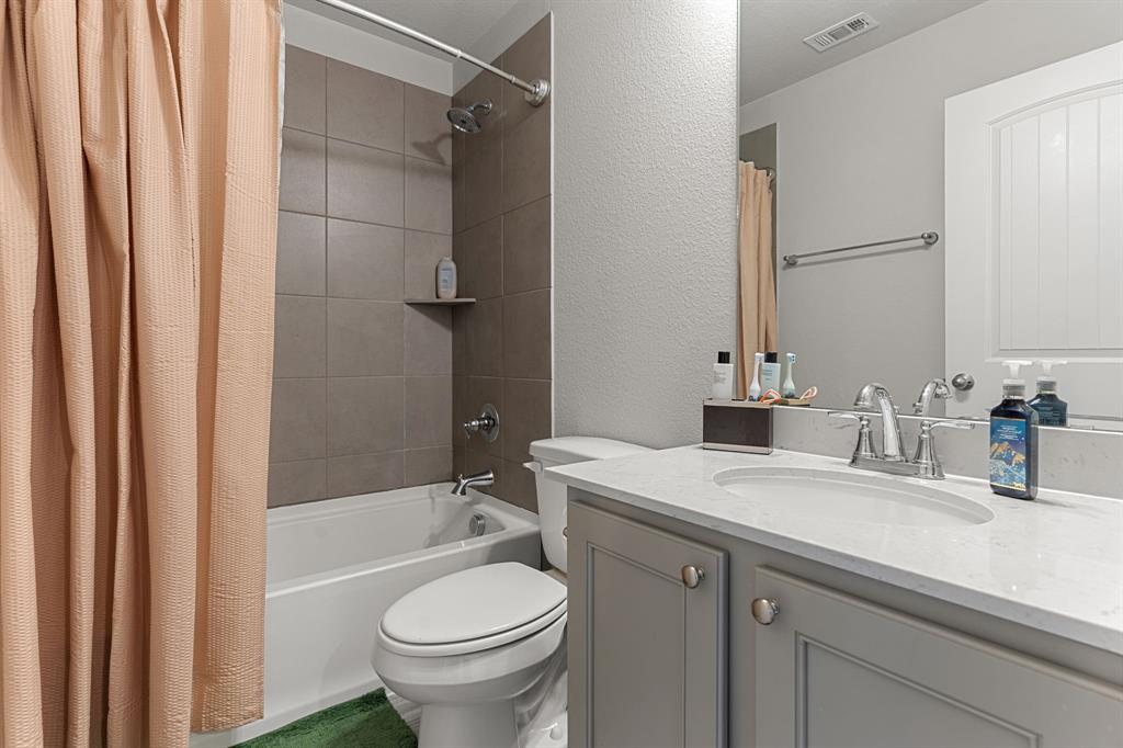 2012 Elara Drive Haslet, TX 76052 - Photo 28 of 34 a bathroom with a sink toilet and shower