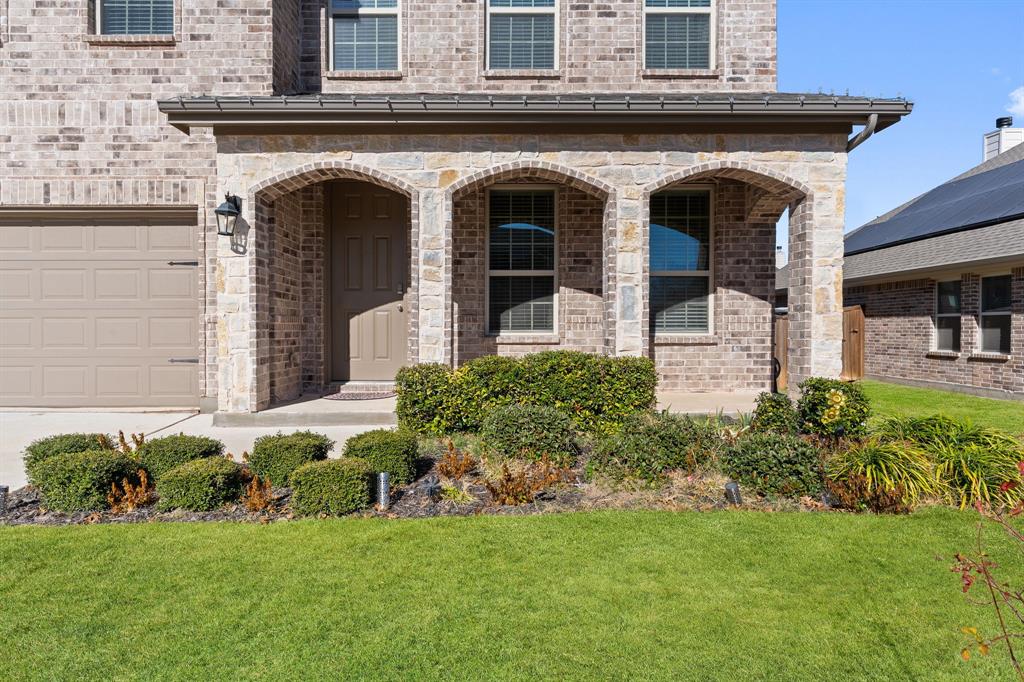 2012 Elara Drive Haslet, TX 76052 - Photo 3 of 34 a front view of a house with garden