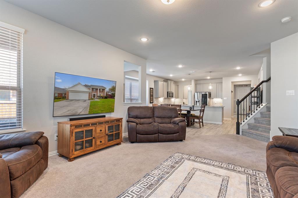 2012 Elara Drive Haslet, TX 76052 - Photo 10 of 34 a living room with furniture and a flat screen tv