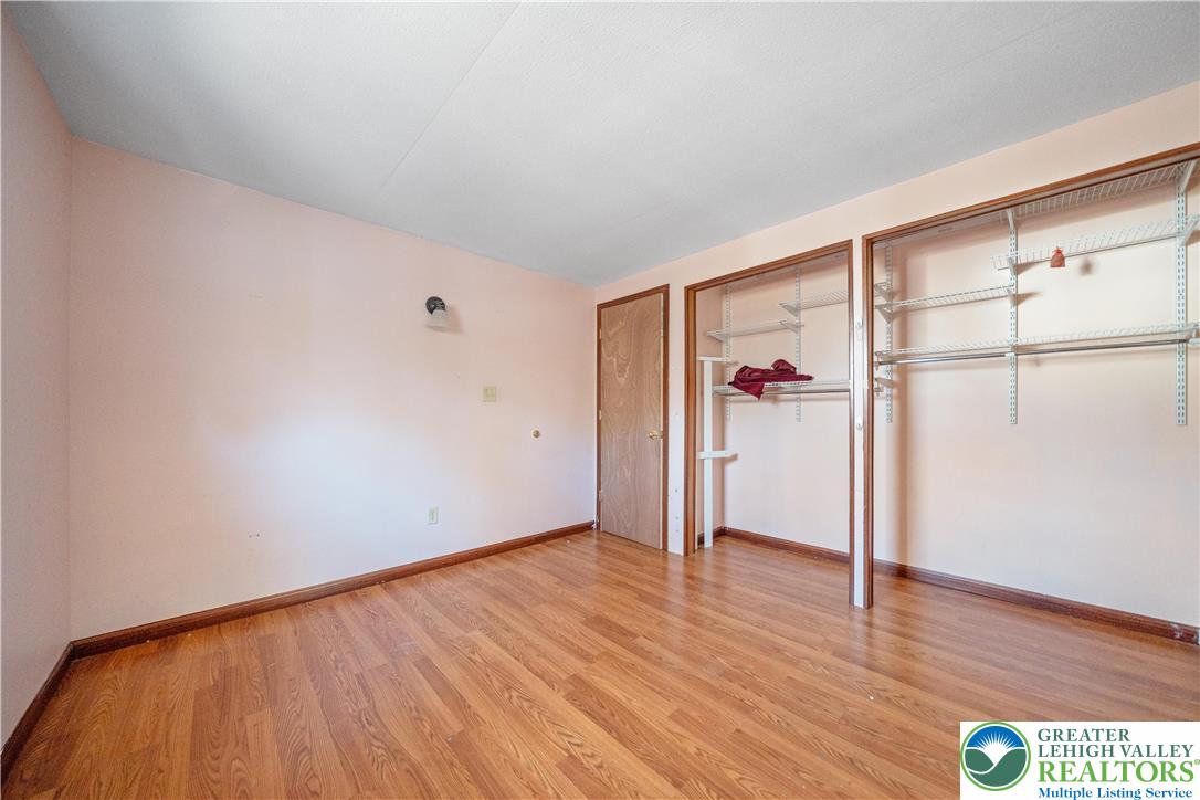 664 Cranberry Road, Unit 1 East Stroudsburg, PA 18301 - Photo 12 of 22 a view of an empty room with wooden floor