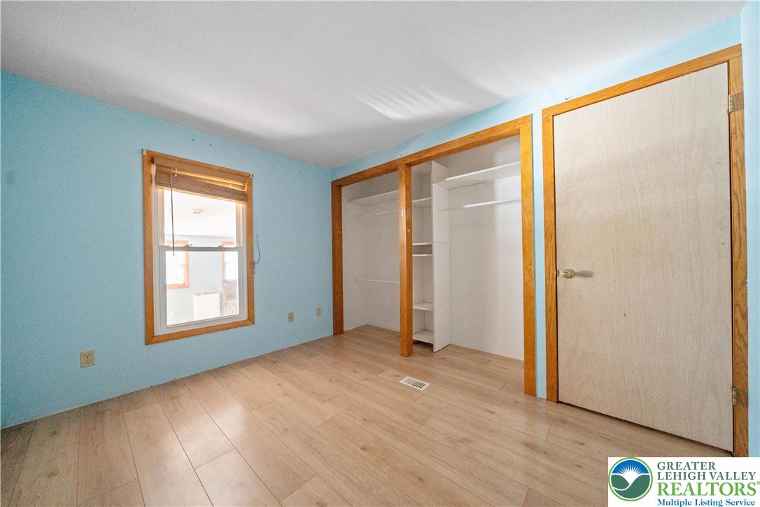 664 Cranberry Road, Unit 1 East Stroudsburg, PA 18301 - Photo 13 of 22 an empty room with windows and closet