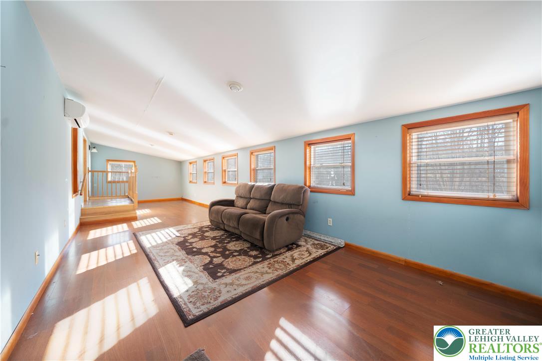 664 Cranberry Road, Unit 1 East Stroudsburg, PA 18301 - Photo 2 of 22 a living room with furniture rug and window