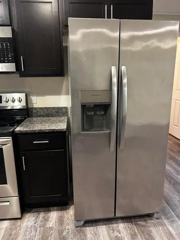 a view of a livingroom with wooden floor