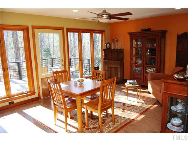 3919 Swarthmore Road Durham, NC 27707 - Photo 5 of 24 Family room is bathed in natural light with access to expansive deck, views of wooded back yard and open to kitchen. Den/Family/Great Room