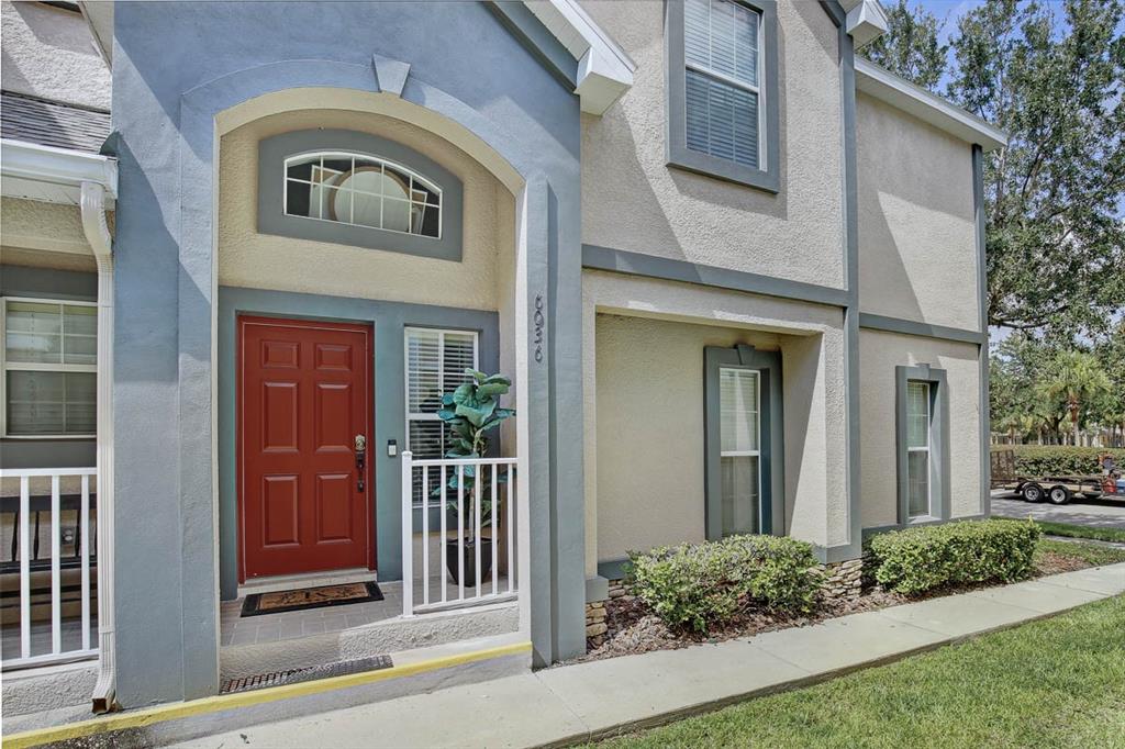 6036 Fishhawk Crossing Boulevard Lithia, FL 33547 - Photo 1 of 1 a front view of a house with a porch