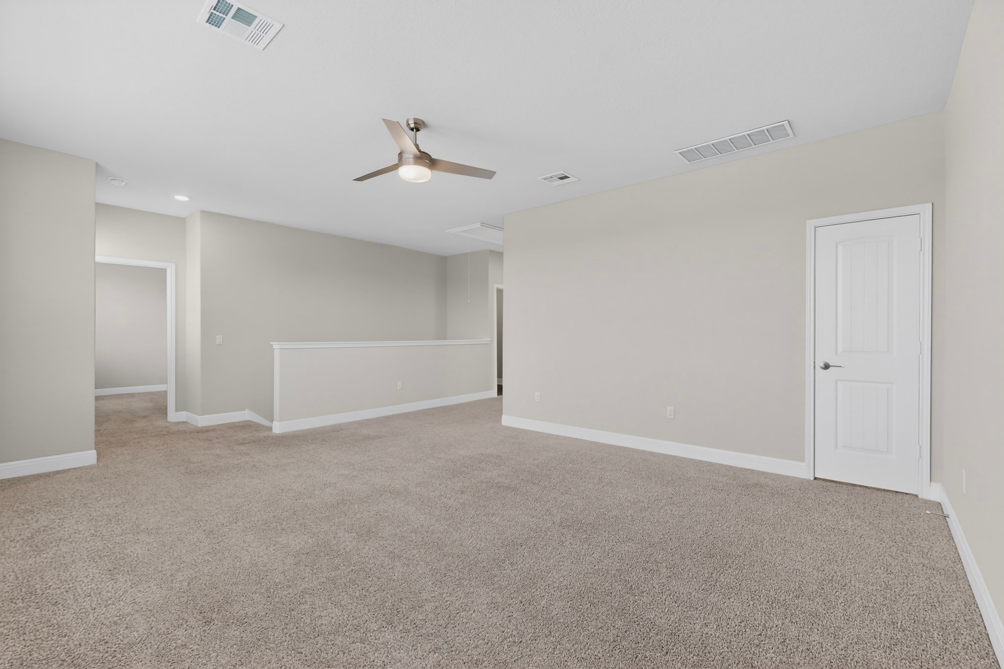16809 Guido Cove Pflugerville, TX 78660 - Photo 23 of 40 Spacious carpeted room featuring a contemporary ceiling fan, recessed lighting, and light-toned walls with white trim