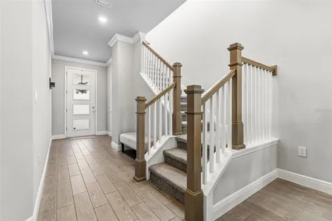 a kitchen with stainless steel appliances kitchen island granite countertop a refrigerator and a sink