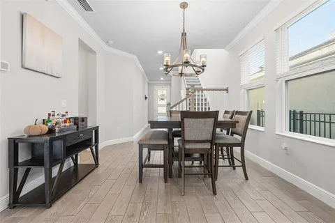 a kitchen with stainless steel appliances granite countertop a sink a counter space and a window