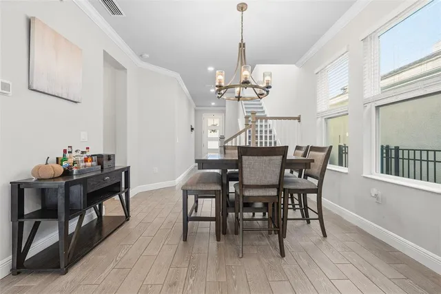 a kitchen with stainless steel appliances granite countertop a sink a counter space and a window