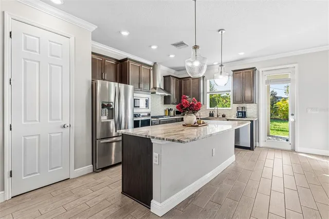 a living room with furniture tv and large window