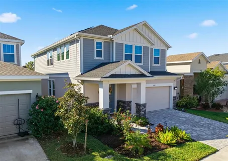 a front view of a house with a yard and porch