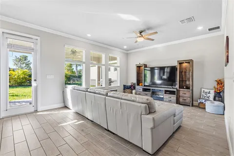 an empty room with windows and bathroom