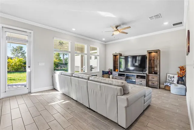 an empty room with windows and bathroom