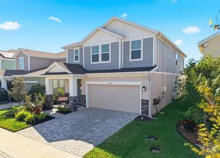 a view of an house with backyard space and garden