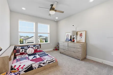 an aerial view of a house with swimming pool and outdoor seating
