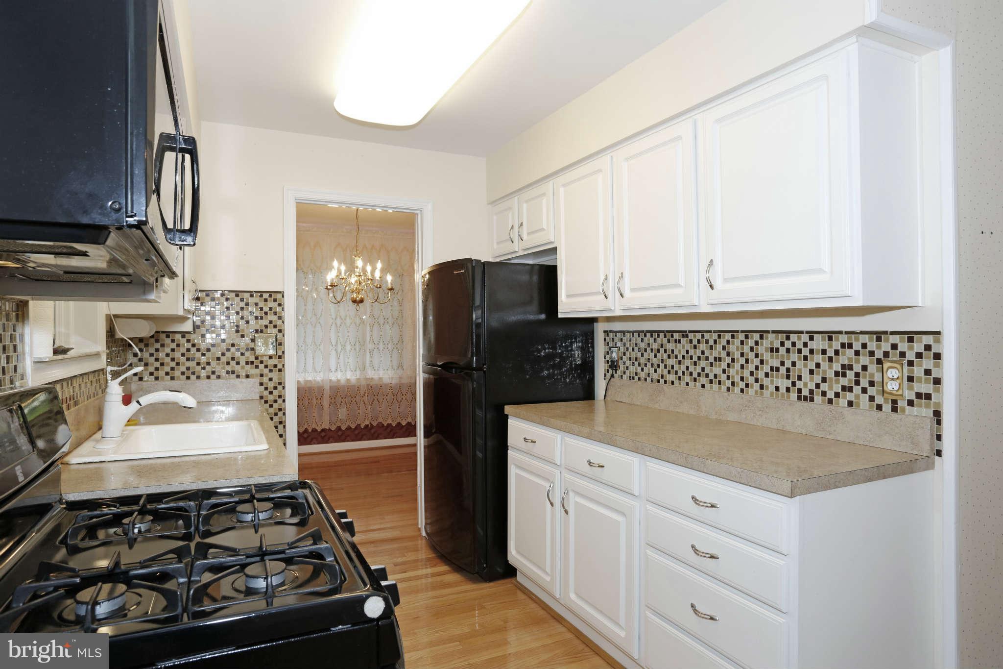 5904 River Road Bethesda, MD 20816 - Photo 9 of 25 Kitchen w/white cabinets