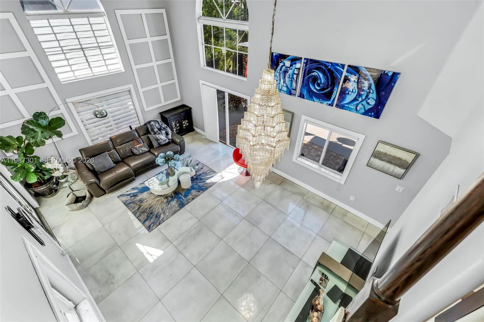 12940 Southwest 142nd Terrace Miami, FL 33186 - Photo 12 of 44 a view of living room with furniture and rug